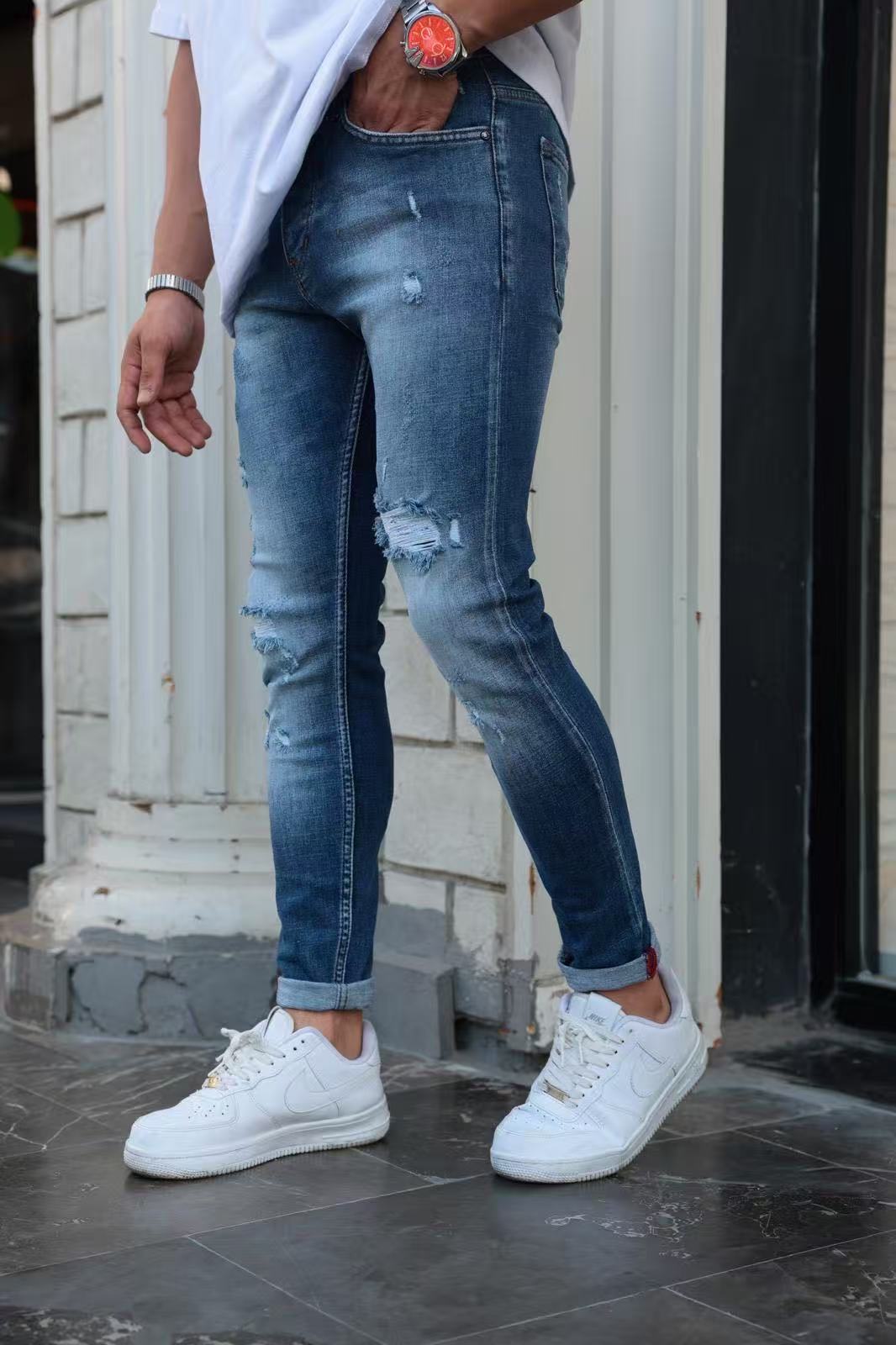 Jean slim fit bleu vintage à déchirures renforcées – Homme