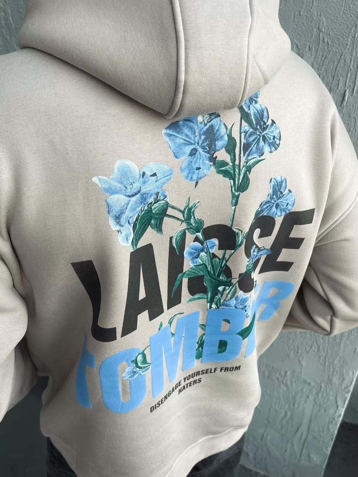 Sweat à capuche imprimé LAISSE TOMBER beige
