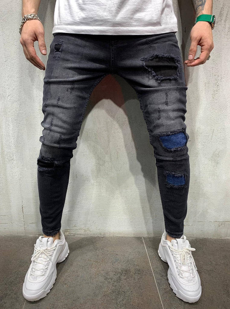 Jeans skinny noir avec déchirures homme