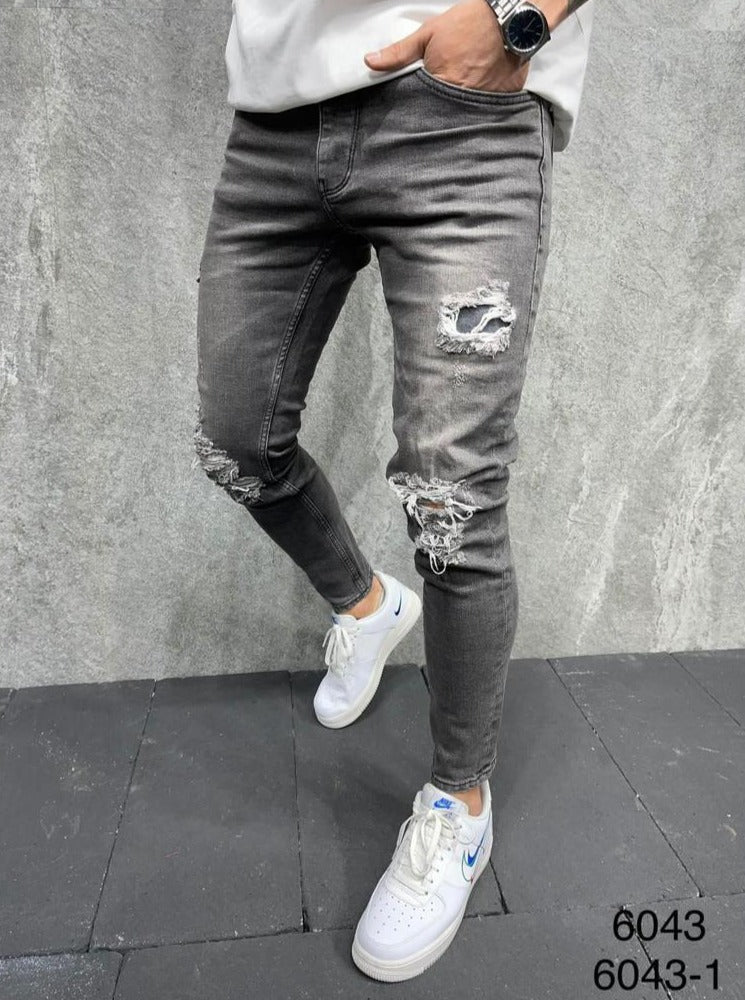 Jeans skinny gris avec déchirures sur le genoux homme 2y premium